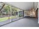 Large screened porch featuring tiled floor and backyard views at 614 Fayette S Dr, Safety Harbor, FL 34695