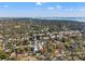 Stunning aerial view of a neighborhood with lush greenery and distant cityscape on a sunny day at 6904 S Macdill Ave # 1, Tampa, FL 33611