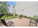 Paver patio includes space for multiple seating options in this home's backyard at 6904 S Macdill Ave # 1, Tampa, FL 33611