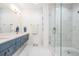 Contemporary bathroom features a glass shower with pebble floor and luxurious finishes at 6904 S Macdill Ave # 1, Tampa, FL 33611