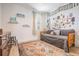 Cozy bedroom featuring a comfortable daybed, light-filled window, and decorative wall art at 6904 S Macdill Ave # 1, Tampa, FL 33611
