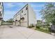 Contemporary townhome features an attached 2-car garage and manicured landscaping at 6904 S Macdill Ave # 1, Tampa, FL 33611