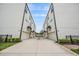 View of townhouse exteriors, showcasing modern design and attached garages at 6904 S Macdill Ave # 1, Tampa, FL 33611