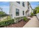 Contemporary exterior view featuring a low fence, drought tolerant plantings, and minimalist design at 6904 S Macdill Ave # 1, Tampa, FL 33611