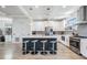 Contemporary kitchen featuring a large island with seating and modern appliances at 6904 S Macdill Ave # 1, Tampa, FL 33611