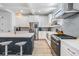 Well-lit kitchen with a center island, modern appliances, and ample cabinet space at 6904 S Macdill Ave # 1, Tampa, FL 33611