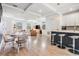 Open-concept living and dining area with modern lighting and an inviting kitchen island at 6904 S Macdill Ave # 1, Tampa, FL 33611