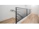 Modern staircase with a sleek metal railing and bright, open design at 6904 S Macdill Ave # 1, Tampa, FL 33611