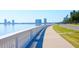 Scenic waterfront view with a pedestrian walkway, bay and city skyline in the background at 6904 S Macdill Ave # 1, Tampa, FL 33611