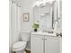 Bright bathroom featuring a new vanity, toilet and shower with curtain at 7023 Montauk Point Xing, Bradenton, FL 34212