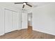 The bright bedroom features hard wood floors, a ceiling fan and spacious closet at 7023 Montauk Point Xing, Bradenton, FL 34212