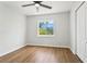 The bright bedroom features hard wood floors, a ceiling fan and big window at 7023 Montauk Point Xing, Bradenton, FL 34212