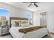 Comfortable main bedroom with access to a bathroom with glass shower at 7023 Montauk Point Xing, Bradenton, FL 34212