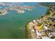 Waterfront home boasts stunning views, lush landscaping, private dock, and inviting outdoor spaces near the bay at 7085 Sunset S Dr # A, St Petersburg, FL 33707