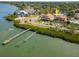 Breathtaking waterfront home with water access, surrounded by lush landscaping, perfect for outdoor activities at 7085 Sunset S Dr # A, St Petersburg, FL 33707