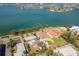A high angle aerial shows a view of the property and pool with waterfront proximity at 7085 Sunset S Dr # A, St Petersburg, FL 33707