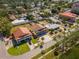 Aerial view of the property showing the tile roof, palm trees, and neighborhood at 7085 Sunset S Dr # A, St Petersburg, FL 33707