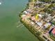 Waterfront home boasts stunning views, lush landscaping, private dock, and inviting outdoor spaces near the bay at 7085 Sunset S Dr # A, St Petersburg, FL 33707
