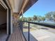 Balcony overlooking street, trees, and water at 7085 Sunset S Dr # A, St Petersburg, FL 33707