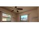 Bedroom with natural light streaming through the windows, featuring a ceiling fan at 7085 Sunset S Dr # A, St Petersburg, FL 33707