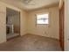 Bedroom featuring neutral carpet, standard closet and a ceiling fan at 7085 Sunset S Dr # A, St Petersburg, FL 33707