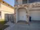 Charming home entrance featuring stone accents and a double door, with an attached garage, offering curb appeal and convenience at 7085 Sunset S Dr # A, St Petersburg, FL 33707