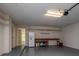 Spacious garage with ample storage, a work bench and a door to the main part of the house at 7085 Sunset S Dr # A, St Petersburg, FL 33707