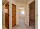 Hallway view of multiple bedrooms and a bathroom including a linen closet at 7085 Sunset S Dr # A, St Petersburg, FL 33707
