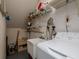 Functional laundry room with modern washing machine, utility sink, and extra shelving at 7085 Sunset S Dr # A, St Petersburg, FL 33707