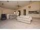 Bright living room with ceiling fan at 7085 Sunset S Dr # A, St Petersburg, FL 33707