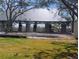 Newly renovated park pavilion features stone pillars, shade, and green space for community events and gatherings at 7085 Sunset S Dr # A, St Petersburg, FL 33707