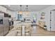 Modern kitchen with a large island and pendant lighting, offering an inviting space at 716 75Th N St, St Petersburg, FL 33710