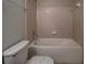 Bathroom with combined shower and bathtub with ceramic tiles at 8531 Trail Wind Dr, Tampa, FL 33647