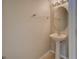 This bathroom includes a pedestal sink, oval mirror, and chrome towel rack at 8531 Trail Wind Dr, Tampa, FL 33647