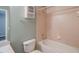 Bathroom with combined shower and bathtub, white cabinet and ceramic tiles at 8531 Trail Wind Dr, Tampa, FL 33647