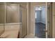 Bathroom featuring a stand up shower and view of the bedroom at 8531 Trail Wind Dr, Tampa, FL 33647