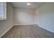 The bedroom has a ceiling fan, natural light and newer flooring at 8531 Trail Wind Dr, Tampa, FL 33647