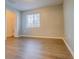 A bright bedroom features a ceiling fan, closet and walk-in closet at 8531 Trail Wind Dr, Tampa, FL 33647