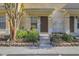 Welcoming townhouse entrance with manicured landscaping and convenient access at 8531 Trail Wind Dr, Tampa, FL 33647