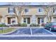 Charming townhouse exterior featuring reserved parking and well-maintained landscaping at 8531 Trail Wind Dr, Tampa, FL 33647