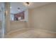 Open concept living area features tile floors and view of the kitchen with wood cabinets at 8531 Trail Wind Dr, Tampa, FL 33647