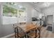 Bright breakfast nook features a wooden table, chairs, and a view of the yard at 905 Clearcreek Dr, Tampa, FL 33613