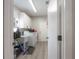 Well-lit laundry room with cabinets, sink, and washer/dryer at 905 Clearcreek Dr, Tampa, FL 33613