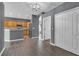 Open-concept living room with wood-style floors, recessed lighting, and arched doorway at 9644 Jasmine Brook Cir, Land O Lakes, FL 34638