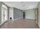 Inviting living room featuring hardwood floors, large windows, and neutral wall colors at 9644 Jasmine Brook Cir, Land O Lakes, FL 34638