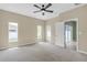 Spacious main bedroom with carpet, large windows, and ample natural light at 9644 Jasmine Brook Cir, Land O Lakes, FL 34638