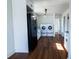Bright laundry area featuring a washer and dryer hookup, plus a sink, lighting, and luxury laminate flooring at 9706 N 22Nd St, Tampa, FL 33612