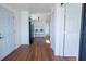 Bright laundry area featuring a washer and dryer hookup, plus room for additional storage, and luxury laminate flooring at 9706 N 22Nd St, Tampa, FL 33612
