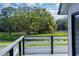 Scenic view from the home of lush trees and a tranquil pond at 9706 N 22Nd St, Tampa, FL 33612