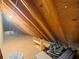 Spacious attic storage area with exposed wooden beams and plywood flooring at 10206 N Hyaleah Rd, Tampa, FL 33617